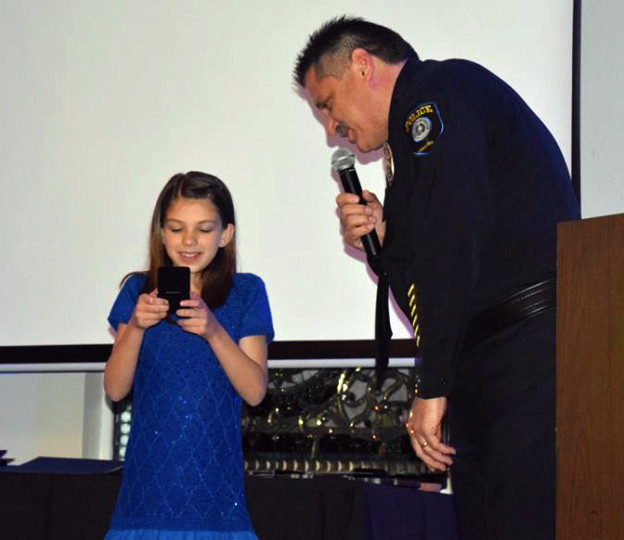 Cedar Hill Police Chief Steve Rhodes presented Camryn Samuel with the Department's Official Coin during a ceremony on Feb. 21.