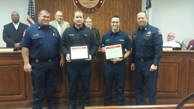 A group of Red Oak first responders receive award for saving the life of a heart attack victim on September 8, 2015.