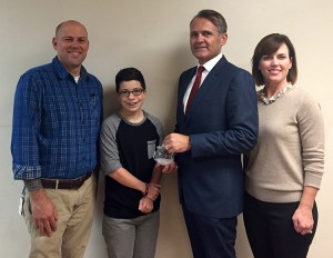 Rep. John Wray receiving the finished Christmas ornament from the WHS Art Department. Pictured from left to right: Art Teacher Sean Cagle, Student Heather Stuckey, Rep. John Wray, and Michele Wray.