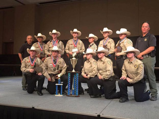 Front row, from left: Ellis County Sheriff’s Office Explorers Lt. Ross McRee of Midlothian, Explorer Remigio Gomez of Waxahachie, Explorer Allison Bush of Ennis, Explorer Sara Segura of Waxahachie, Explorer Angela Duncan of Ennis. Back row: Advisor Arnold Aguilar, Explorer Matthew Aguilar of Waxahachie, Explorer Capt. Gage Adams of Waxahachie, Explorer Sgt. Isiah Bias of Waxahachie, Explorer Tristan McQueen of Italy, Explorer Everett Bias of Waxahachie, Explorer Cpl. Noel Campbell  of Midlothian and Assistant Advisor Hunter Barnes.